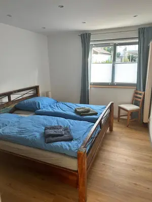 Ein Bett oder Betten in einem Zimmer der Unterkunft Ferienwohnung am Kastanienbusch