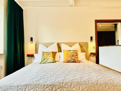 Ein Bett oder Betten in einem Zimmer der Unterkunft Pfalz Apartments - zentral, elegant, komfortabel