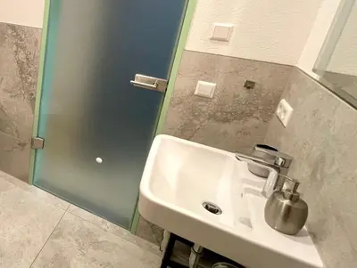 Ein Badezimmer in der Unterkunft Goldstadt White Suite - City Apartament Schlössle Pforzheim