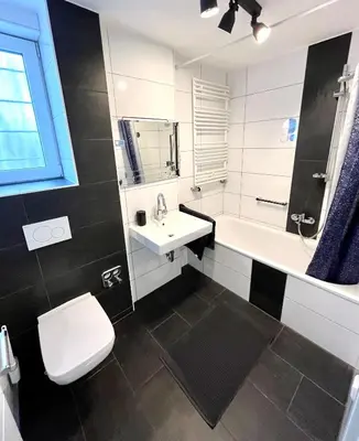 Ein Badezimmer in der Unterkunft Ganze Wohnung - Parkplatz - Wi-fi - Küche - Balkon