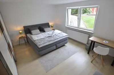 Ein Bett oder Betten in einem Zimmer der Unterkunft Villa Residenz