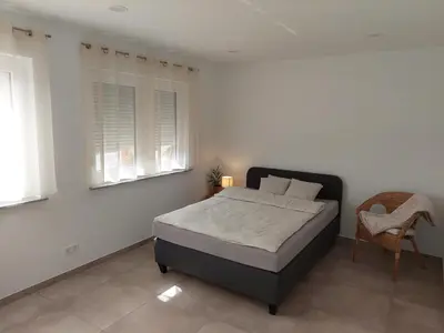 Ein Bett oder Betten in einem Zimmer der Unterkunft Monteurwohnung Ferienwohnung