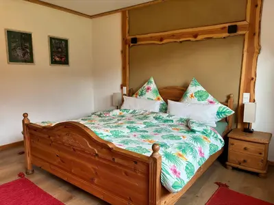 Ein Bett oder Betten in einem Zimmer der Unterkunft Ferienhaus Drei Mühlen
