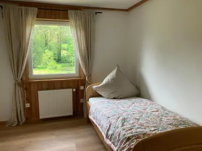 Ein Bett oder Betten in einem Zimmer der Unterkunft Ferienhaus Drei Mühlen