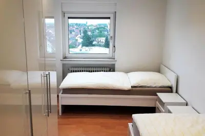 Ein Bett oder Betten in einem Zimmer der Unterkunft Stadtwohnung Eppelheim
