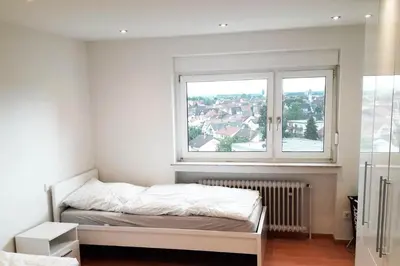 Ein Bett oder Betten in einem Zimmer der Unterkunft Stadtwohnung Eppelheim