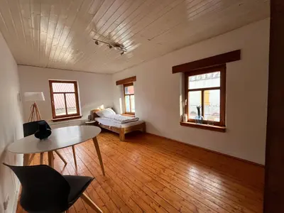 Ein Bett oder Betten in einem Zimmer der Unterkunft Ferienwohnung am Schloss
