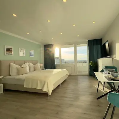 TV/Unterhaltungsangebot in der Unterkunft M&D Apartments nähe Stadion mit Klimaanlage - Netflix - Küche - Sunset View - Balkon