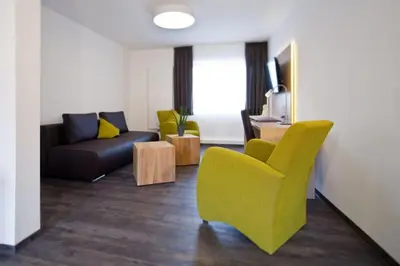 Ein Sitzbereich in der Unterkunft Boardinghouse Rülzheim