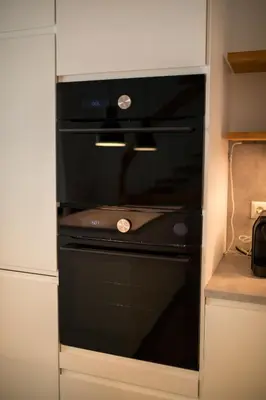 Küche/Küchenzeile in der Unterkunft HUGOS Design Apartment am Waldrand - ruhig & modern