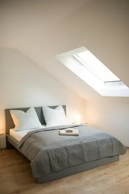 Ein Bett oder Betten in einem Zimmer der Unterkunft HUGOS Design Apartment am Waldrand - ruhig & modern