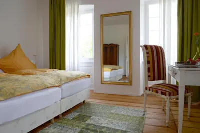 Ein Bett oder Betten in einem Zimmer der Unterkunft Alte Apotheke Bed & Breakfast