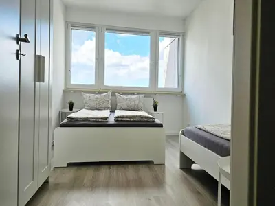 Ein Bett oder Betten in einem Zimmer der Unterkunft City Apartment in Eppelheim near Heidelberg