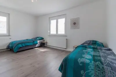 Ein Bett oder Betten in einem Zimmer der Unterkunft nJoy! Apartment Heilbronn - Zentral & Garten