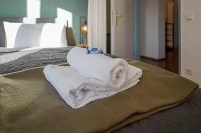 Ein Bett oder Betten in einem Zimmer der Unterkunft Große, gemütliche 4-Zimmer-Ferienwohnung mit guter Verkehrsanbindung im Süden von Heidelberg