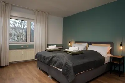 Ein Bett oder Betten in einem Zimmer der Unterkunft Große, gemütliche 4-Zimmer-Ferienwohnung mit guter Verkehrsanbindung im Süden von Heidelberg