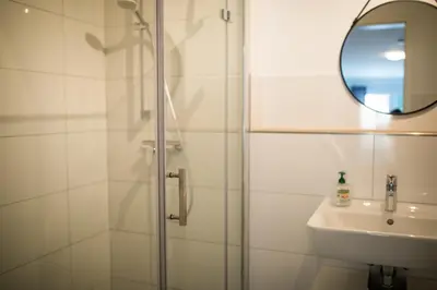 Ein Badezimmer in der Unterkunft HUGOS Design House am Waldrand - ruhig & modern