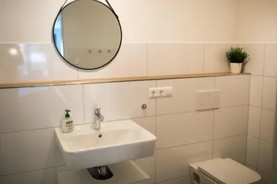 Ein Badezimmer in der Unterkunft HUGOS Design House am Waldrand - ruhig & modern