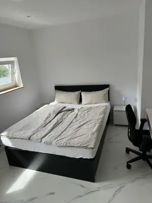 Ein Bett oder Betten in einem Zimmer der Unterkunft Gemütliche Wohnung in Heilbronn