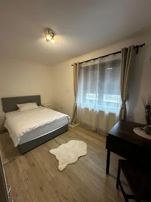 Ein Bett oder Betten in einem Zimmer der Unterkunft VDM Ferienwohung Pfungstadt