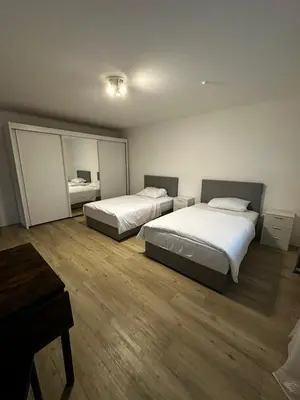 Ein Bett oder Betten in einem Zimmer der Unterkunft VDM Ferienwohung Pfungstadt