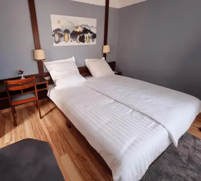Ein Bett oder Betten in einem Zimmer der Unterkunft QC5 Pension Buchen in Odenwald