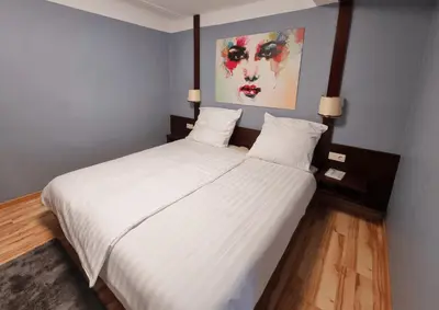 Ein Bett oder Betten in einem Zimmer der Unterkunft QC5 Pension Buchen in Odenwald