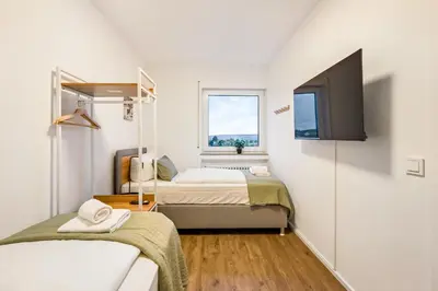 Ein Bett oder Betten in einem Zimmer der Unterkunft Salí Homes Weinblick Beethoven - ruhige Feldlage