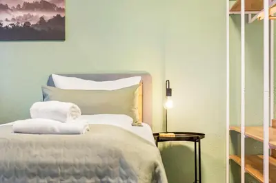 Ein Bett oder Betten in einem Zimmer der Unterkunft Salí Homes Weinblick Beethoven - ruhige Feldlage