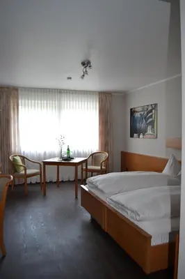 Ein Bett oder Betten in einem Zimmer der Unterkunft Aparthotel Sprendlingen