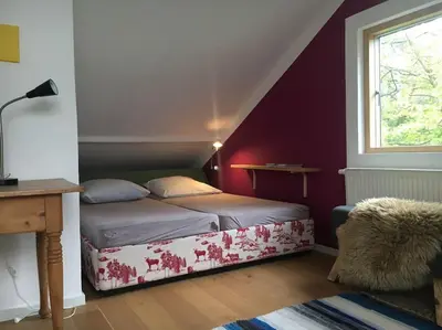 Ein Bett oder Betten in einem Zimmer der Unterkunft Ferienhaus im Wald an der Weinstrasse