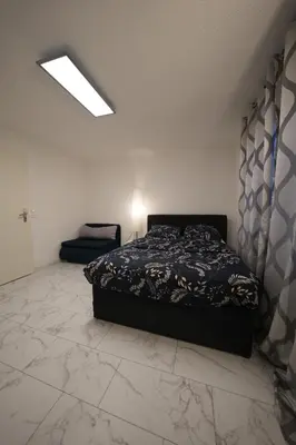 Ein Bett oder Betten in einem Zimmer der Unterkunft Stilvolle 2-Zimmer-Oase
