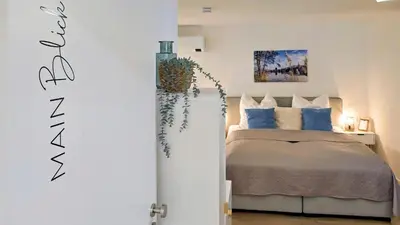 Ein Bett oder Betten in einem Zimmer der Unterkunft Mainzauber Apartments Miltenberg