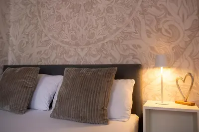 Ein Bett oder Betten in einem Zimmer der Unterkunft Galilei Apartment 1