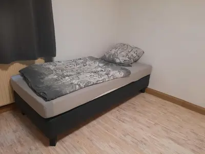 Ein Bett oder Betten in einem Zimmer der Unterkunft gemütliche Wohnung im Herzen von Heilbronn