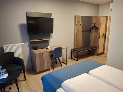 Ein Bett oder Betten in einem Zimmer der Unterkunft Hotel am Hardtsee