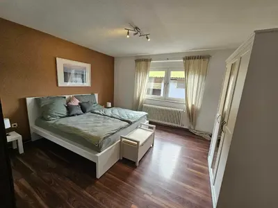 Ein Bett oder Betten in einem Zimmer der Unterkunft Ferienwohnung auf Islandpferdegestüt