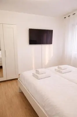 Ein Bett oder Betten in einem Zimmer der Unterkunft Luxus Wohnung am Rand von Stuttgart