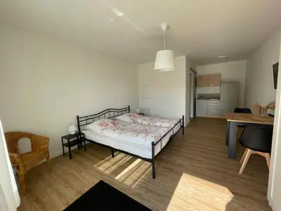Ein Bett oder Betten in einem Zimmer der Unterkunft Gästezimmer im Weingut Kissel