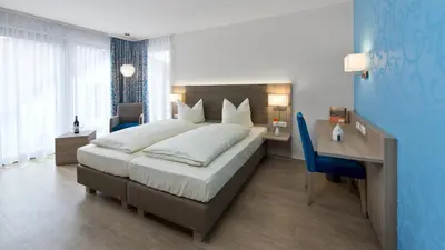 Ein Bett oder Betten in einem Zimmer der Unterkunft Landhotel im Klostereck