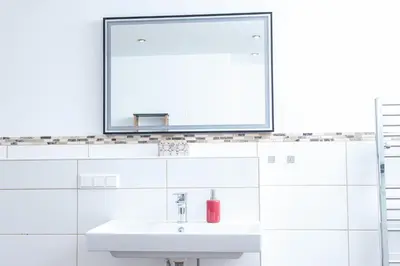 Ein Badezimmer in der Unterkunft nidusROOMS moderne Barock Suite