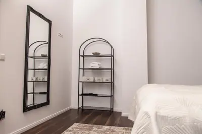 Ein Bett oder Betten in einem Zimmer der Unterkunft nidusROOMS moderne Barock Suite