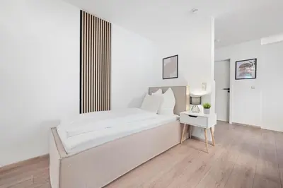 Ein Bett oder Betten in einem Zimmer der Unterkunft Malu Rooms - im Stadtzentrum, Klima, SmartTV, Netflix, 24h Checkin