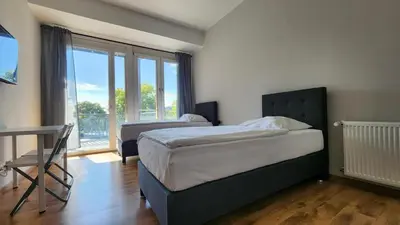 Ein Bett oder Betten in einem Zimmer der Unterkunft Helle Wohnung mit Balkon perfekt für Monteure und Arbeiter