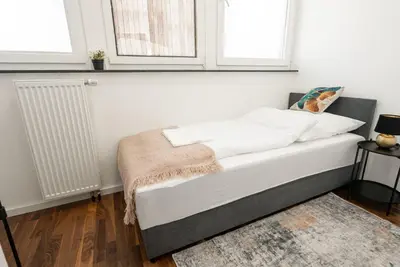 Ein Bett oder Betten in einem Zimmer der Unterkunft Top Moderne 2 Zimmer Wohnung