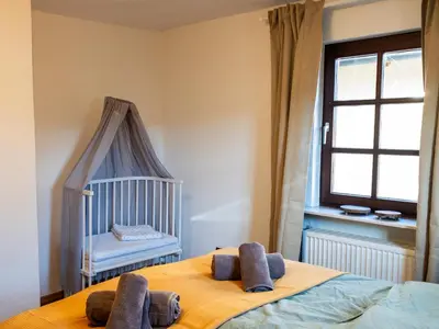 Ein Bett oder Betten in einem Zimmer der Unterkunft Familienglück im Waldglück Pfalz