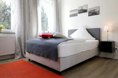 Ein Bett oder Betten in einem Zimmer der Unterkunft Ferienwohnung Leinbaum