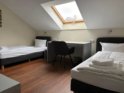 Ein Bett oder Betten in einem Zimmer der Unterkunft Pension Gergert am Neckar