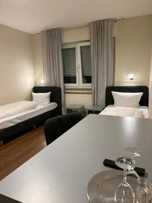 Ein Bett oder Betten in einem Zimmer der Unterkunft Pension Gergert am Neckar