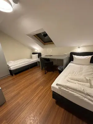 Ein Bett oder Betten in einem Zimmer der Unterkunft Pension Gergert am Neckar